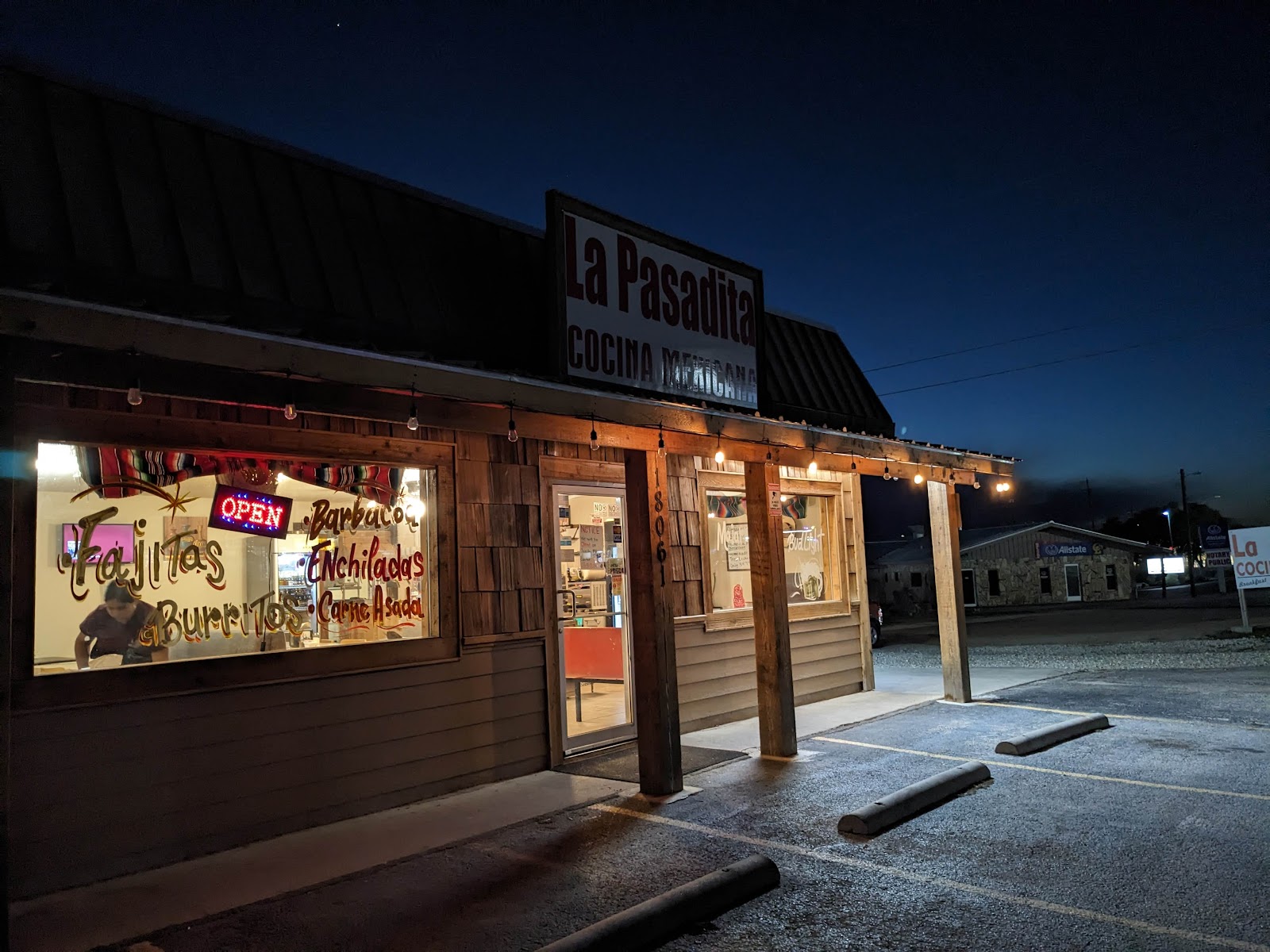 La Pasadita Cocina Mexicana storefront at dusk with neon open sign