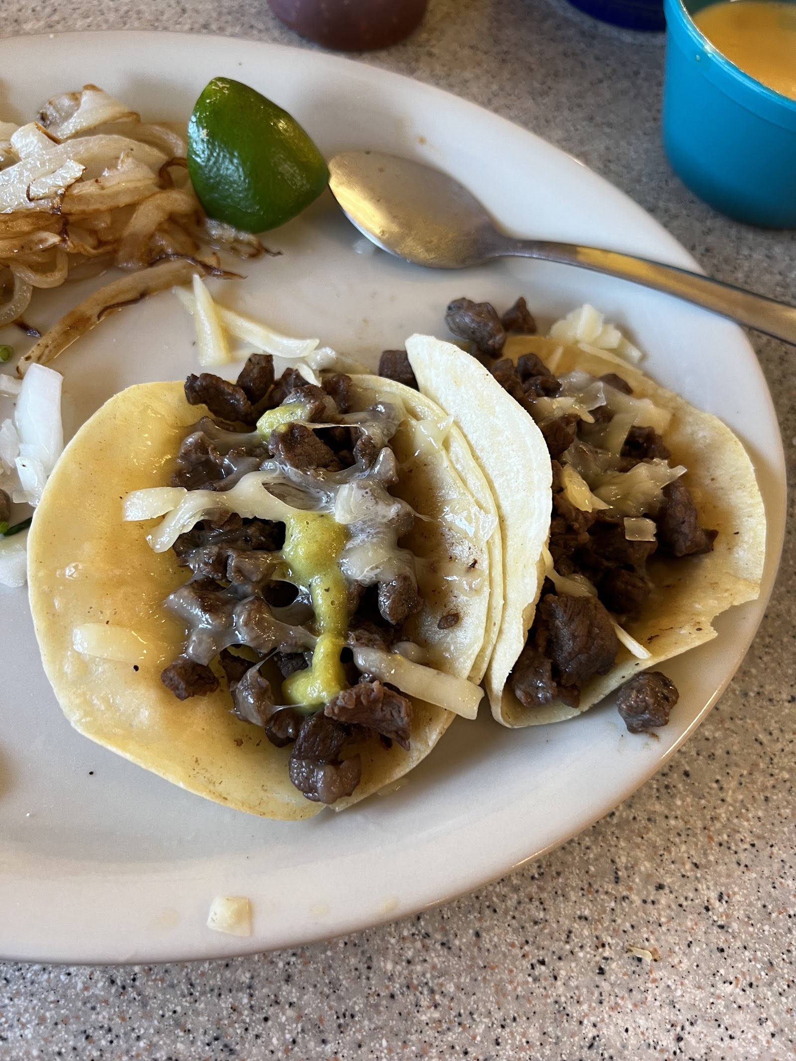 Street tacos with grilled beef, onion, and cheese